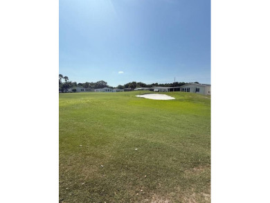 Indulge in expansive living within this magnificent double-wide on Hamptons Golf Club in Florida - for sale on GolfHomes.com, golf home, golf lot