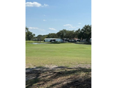 Indulge in expansive living within this magnificent double-wide on Hamptons Golf Club in Florida - for sale on GolfHomes.com, golf home, golf lot