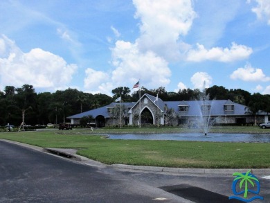 Indulge in expansive living within this magnificent double-wide on Hamptons Golf Club in Florida - for sale on GolfHomes.com, golf home, golf lot