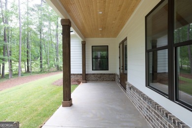 The Reagan plan built by Tradecraft Homes.  Luxury awaits you in on Harbor Club Golf and Country Club in Georgia - for sale on GolfHomes.com, golf home, golf lot
