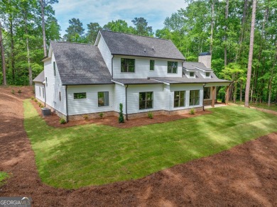 The Reagan plan built by Tradecraft Homes.  Luxury awaits you in on Harbor Club Golf and Country Club in Georgia - for sale on GolfHomes.com, golf home, golf lot