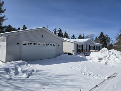 Golf course living on Thunder Bay Golf Course overlooking Hole on Thunder Bay Golf Resort in Michigan - for sale on GolfHomes.com, golf home, golf lot
