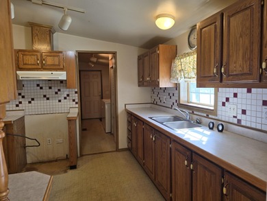 Golf course living on Thunder Bay Golf Course overlooking Hole on Thunder Bay Golf Resort in Michigan - for sale on GolfHomes.com, golf home, golf lot