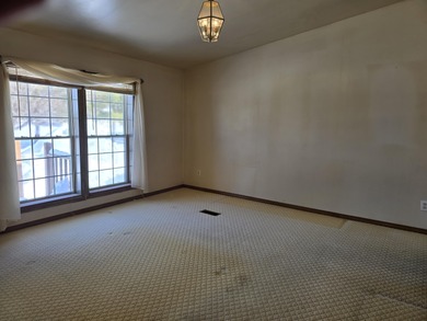 Golf course living on Thunder Bay Golf Course overlooking Hole on Thunder Bay Golf Resort in Michigan - for sale on GolfHomes.com, golf home, golf lot