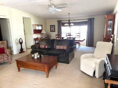Discover this beautifully furnished 3-bedroom, 2-bathroom home on Crystal Lake Club in Florida - for sale on GolfHomes.com, golf home, golf lot