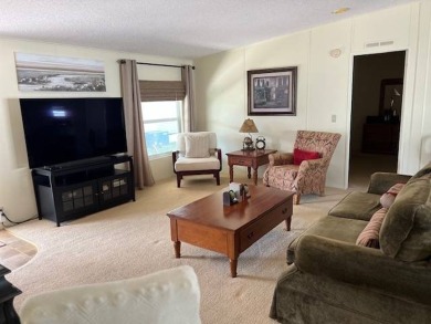Discover this beautifully furnished 3-bedroom, 2-bathroom home on Crystal Lake Club in Florida - for sale on GolfHomes.com, golf home, golf lot