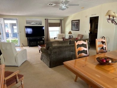 Discover this beautifully furnished 3-bedroom, 2-bathroom home on Crystal Lake Club in Florida - for sale on GolfHomes.com, golf home, golf lot