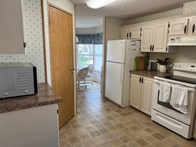 Discover this beautifully furnished 3-bedroom, 2-bathroom home on Crystal Lake Club in Florida - for sale on GolfHomes.com, golf home, golf lot