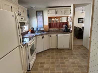 Discover this beautifully furnished 3-bedroom, 2-bathroom home on Crystal Lake Club in Florida - for sale on GolfHomes.com, golf home, golf lot