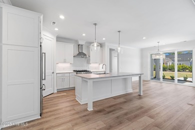 The Sanderling IV by Bell Custom Homes offers a spacious on Cape Fear National At Brunswick Forest in North Carolina - for sale on GolfHomes.com, golf home, golf lot