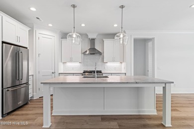 The Sanderling IV by Bell Custom Homes offers a spacious on Cape Fear National At Brunswick Forest in North Carolina - for sale on GolfHomes.com, golf home, golf lot