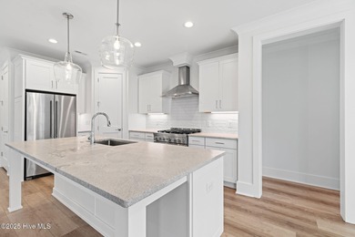 The Sanderling IV by Bell Custom Homes offers a spacious on Cape Fear National At Brunswick Forest in North Carolina - for sale on GolfHomes.com, golf home, golf lot