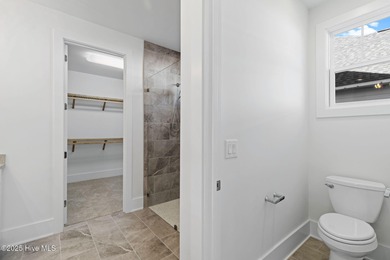 The Sanderling IV by Bell Custom Homes offers a spacious on Cape Fear National At Brunswick Forest in North Carolina - for sale on GolfHomes.com, golf home, golf lot