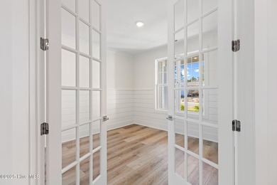 The Sanderling IV by Bell Custom Homes offers a spacious on Cape Fear National At Brunswick Forest in North Carolina - for sale on GolfHomes.com, golf home, golf lot