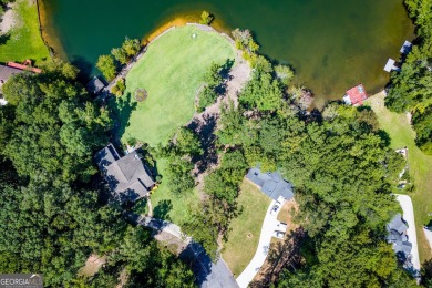Discover lakeside living at its finest with this stunning on Fairfield Plantation Golf and Country Club in Georgia - for sale on GolfHomes.com, golf home, golf lot