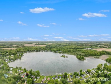 Don't miss this incredible opportunity to own the lakehouse of on Holland Lake Golf Course Inc. in Michigan - for sale on GolfHomes.com, golf home, golf lot