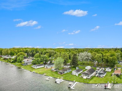 Don't miss this incredible opportunity to own the lakehouse of on Holland Lake Golf Course Inc. in Michigan - for sale on GolfHomes.com, golf home, golf lot