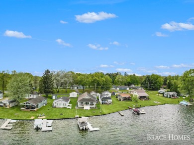 Don't miss this incredible opportunity to own the lakehouse of on Holland Lake Golf Course Inc. in Michigan - for sale on GolfHomes.com, golf home, golf lot