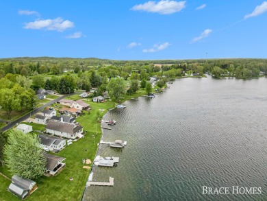 Don't miss this incredible opportunity to own the lakehouse of on Holland Lake Golf Course Inc. in Michigan - for sale on GolfHomes.com, golf home, golf lot