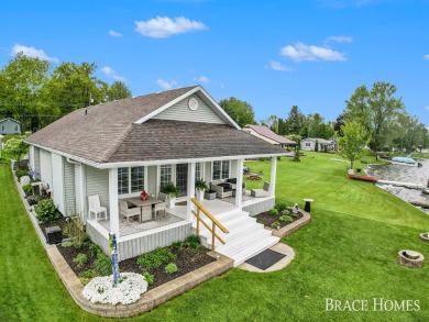 Don't miss this incredible opportunity to own the lakehouse of on Holland Lake Golf Course Inc. in Michigan - for sale on GolfHomes.com, golf home, golf lot