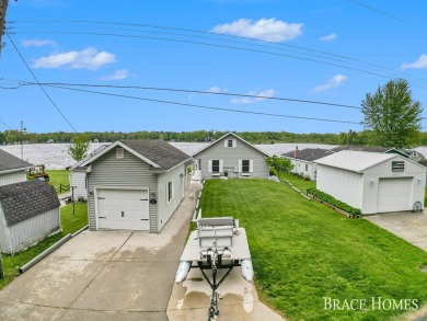 Don't miss this incredible opportunity to own the lakehouse of on Holland Lake Golf Course Inc. in Michigan - for sale on GolfHomes.com, golf home, golf lot