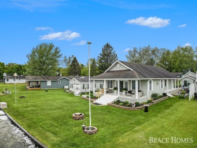 Don't miss this incredible opportunity to own the lakehouse of on Holland Lake Golf Course Inc. in Michigan - for sale on GolfHomes.com, golf home, golf lot