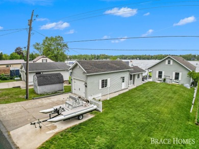 Don't miss this incredible opportunity to own the lakehouse of on Holland Lake Golf Course Inc. in Michigan - for sale on GolfHomes.com, golf home, golf lot