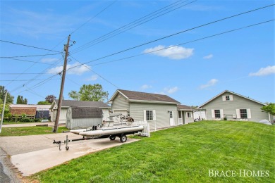 Don't miss this incredible opportunity to own the lakehouse of on Holland Lake Golf Course Inc. in Michigan - for sale on GolfHomes.com, golf home, golf lot