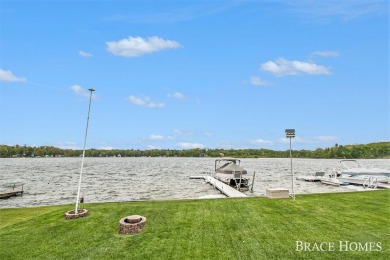 Don't miss this incredible opportunity to own the lakehouse of on Holland Lake Golf Course Inc. in Michigan - for sale on GolfHomes.com, golf home, golf lot