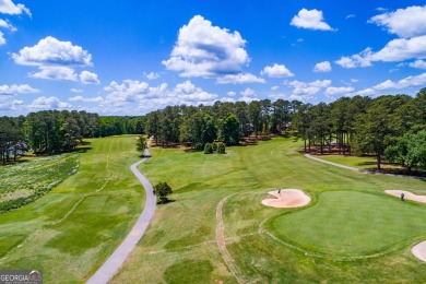 Discover lakeside living at its finest with this stunning on Fairfield Plantation Golf and Country Club in Georgia - for sale on GolfHomes.com, golf home, golf lot