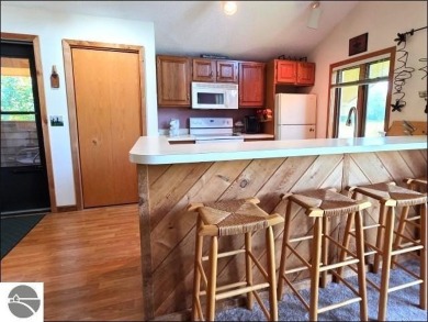 This turn key 2-bedroom, 2-bathroom condo offers beautiful golf on  in Michigan - for sale on GolfHomes.com, golf home, golf lot