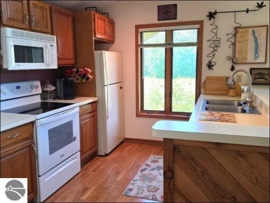 This turn key 2-bedroom, 2-bathroom condo offers beautiful golf on  in Michigan - for sale on GolfHomes.com, golf home, golf lot