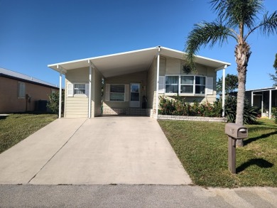 This 1988 offset double-wide home can fulfill your dreams of on Spanish Lakes Country Club in Florida - for sale on GolfHomes.com, golf home, golf lot