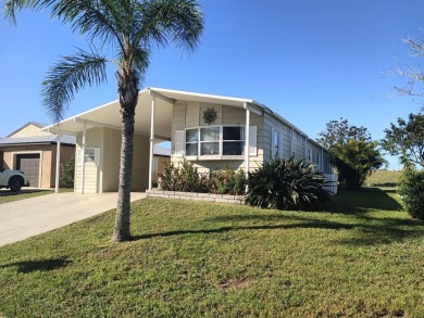 This 1988 offset double-wide home can fulfill your dreams of on Spanish Lakes Country Club in Florida - for sale on GolfHomes.com, golf home, golf lot