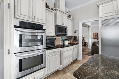 Situated in the gated Intracoastal Waterway community of The on Myrtlewood Golf Course and Club  in South Carolina - for sale on GolfHomes.com, golf home, golf lot