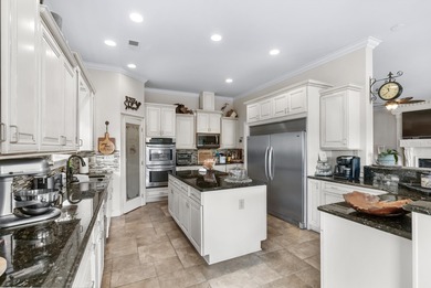 Situated in the gated Intracoastal Waterway community of The on Myrtlewood Golf Course and Club  in South Carolina - for sale on GolfHomes.com, golf home, golf lot