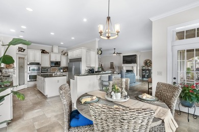 Situated in the gated Intracoastal Waterway community of The on Myrtlewood Golf Course and Club  in South Carolina - for sale on GolfHomes.com, golf home, golf lot