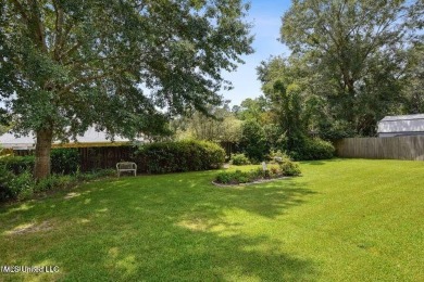 Charming 3-bedroom 2-bathroom home nestled on a beautifully on Diamondhead Country Club in Mississippi - for sale on GolfHomes.com, golf home, golf lot