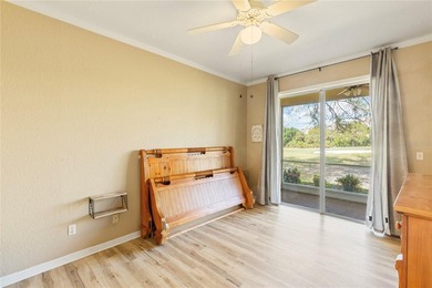 Wake up each morning to peaceful golf course views in this on East Bay Golf Club in Florida - for sale on GolfHomes.com, golf home, golf lot