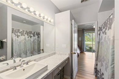 Wake up each morning to peaceful golf course views in this on East Bay Golf Club in Florida - for sale on GolfHomes.com, golf home, golf lot