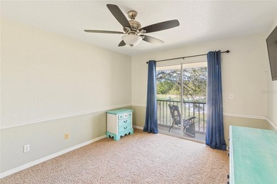 Wake up each morning to peaceful golf course views in this on East Bay Golf Club in Florida - for sale on GolfHomes.com, golf home, golf lot