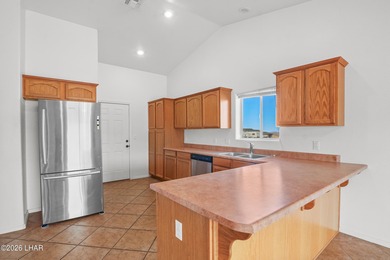 Located in a welcoming golf course community right off Route 66 on Valle Vista Golf Course in Arizona - for sale on GolfHomes.com, golf home, golf lot