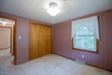 Located in a peaceful neighborhood with a beautiful, wooded on Green Ridge Golf Course in Ohio - for sale on GolfHomes.com, golf home, golf lot
