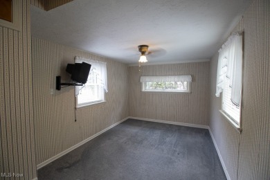 Located in a peaceful neighborhood with a beautiful, wooded on Green Ridge Golf Course in Ohio - for sale on GolfHomes.com, golf home, golf lot