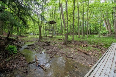 Located in a peaceful neighborhood with a beautiful, wooded on Green Ridge Golf Course in Ohio - for sale on GolfHomes.com, golf home, golf lot