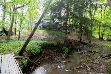 Located in a peaceful neighborhood with a beautiful, wooded on Green Ridge Golf Course in Ohio - for sale on GolfHomes.com, golf home, golf lot