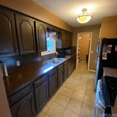 Charming and low-maintenance townhouse located in the heart of on DeSoto Golf Course in Arkansas - for sale on GolfHomes.com, golf home, golf lot