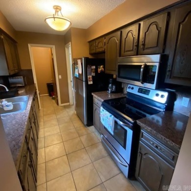 Charming and low-maintenance townhouse located in the heart of on DeSoto Golf Course in Arkansas - for sale on GolfHomes.com, golf home, golf lot