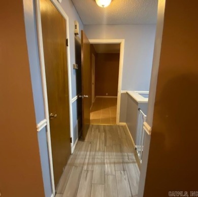 Charming and low-maintenance townhouse located in the heart of on DeSoto Golf Course in Arkansas - for sale on GolfHomes.com, golf home, golf lot