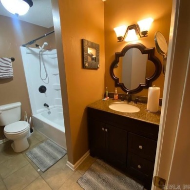 Charming and low-maintenance townhouse located in the heart of on DeSoto Golf Course in Arkansas - for sale on GolfHomes.com, golf home, golf lot